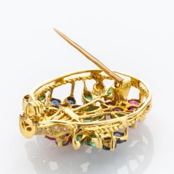 Brosche aus 750er Gold mit Rubin, Saphir, Smaragd und Brillanten