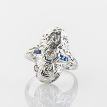 Ring aus 750er Weißgold mit 0.30ct Diamanten und 0.10ct Saphiren