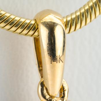 14k gold pendant with a 1.50ct sapphire and 0.30ct diamonds