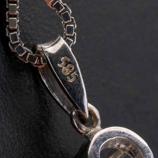 Vintage 14k gold pendant with a diamond