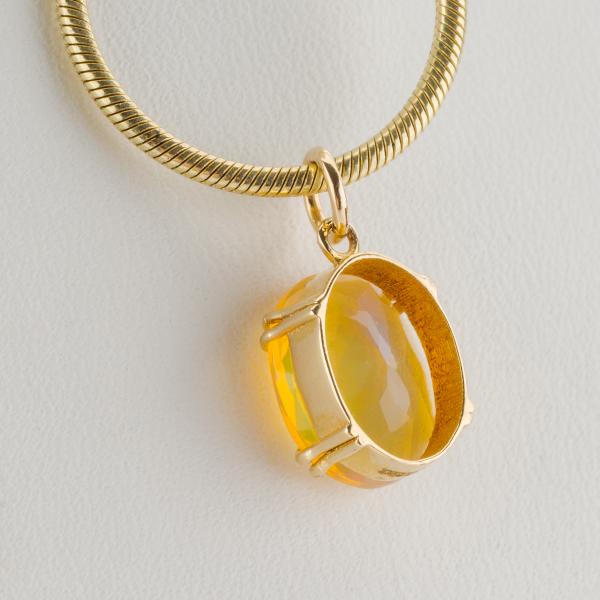 14k gold pendant with an opal