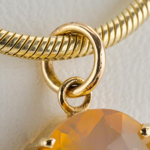 14k gold pendant with an opal