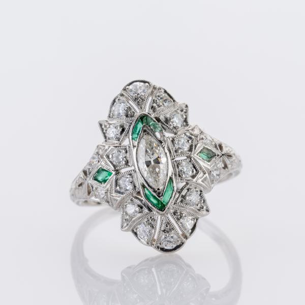 0.80ct Diamond and 0.06ct Emerald Ring in Platinum
