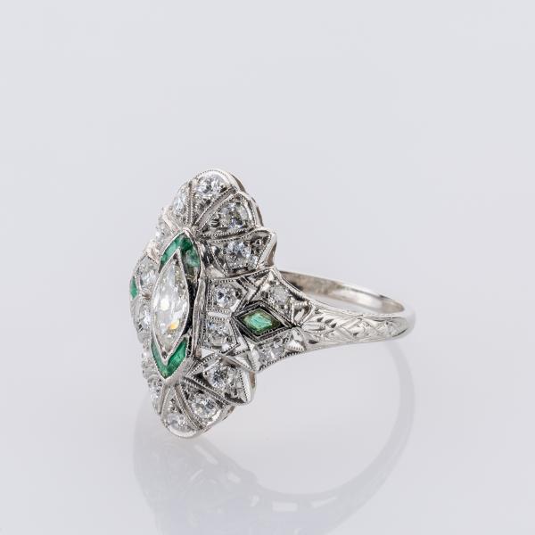 0.80ct Diamond and 0.06ct Emerald Ring in Platinum